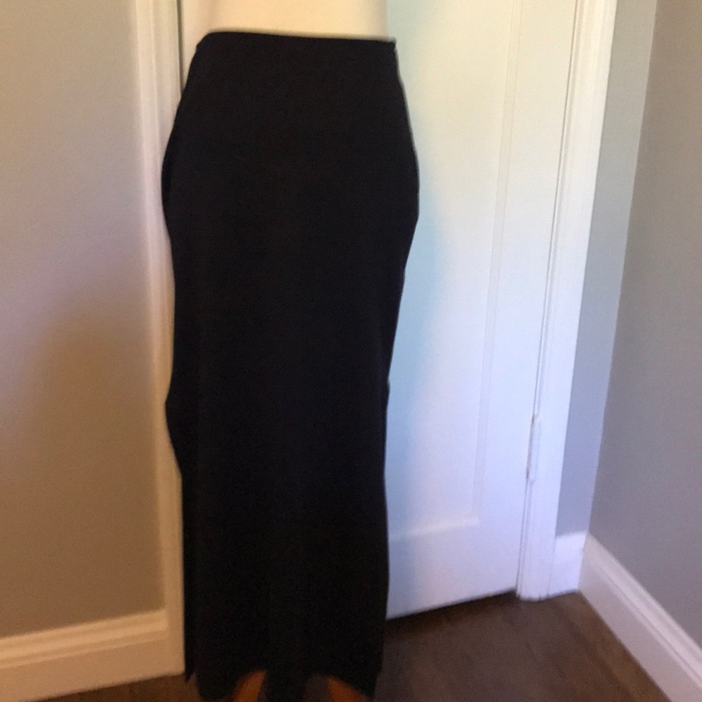 Black maxi skirt with slit openings on each side.